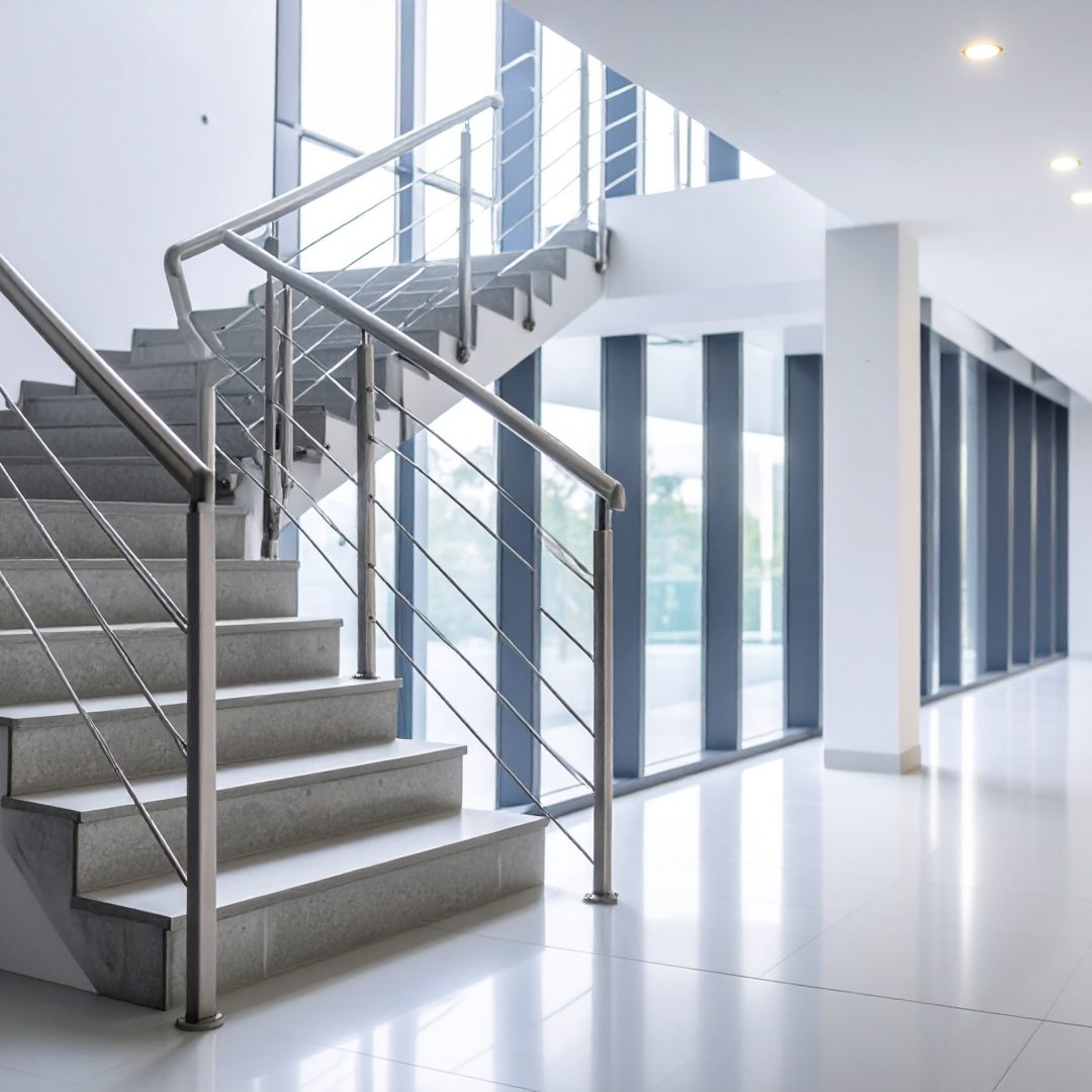 Firefly_Realistic architectural image of handrails installed in a stairwell of a residential 799816